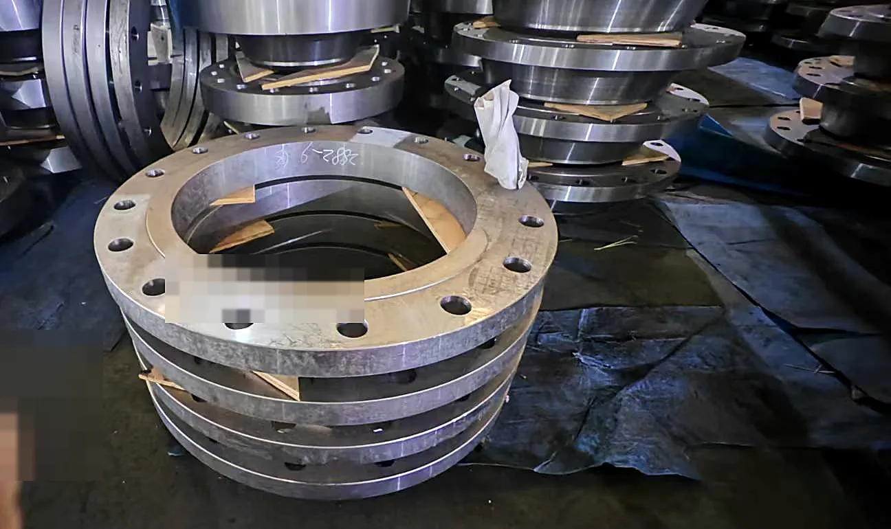 Machined carbon steel flange blank with drilled bolt holes and sealing face