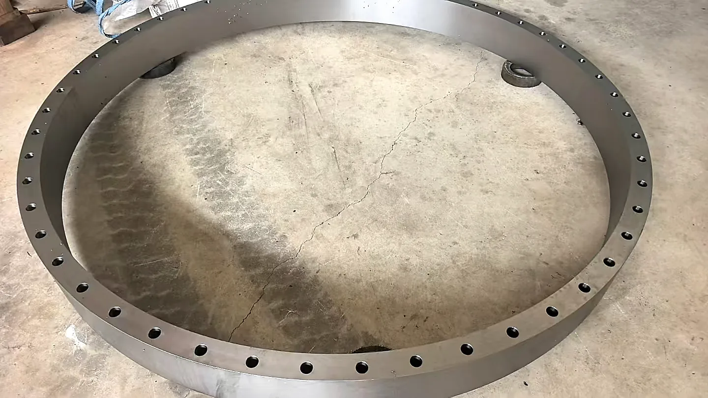 Titanium flange ring with drilled bolt holes, top view